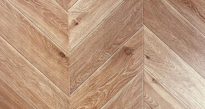 Portofino Chevron - Light Honey Oak Laminate Flooring - Descriptive 1