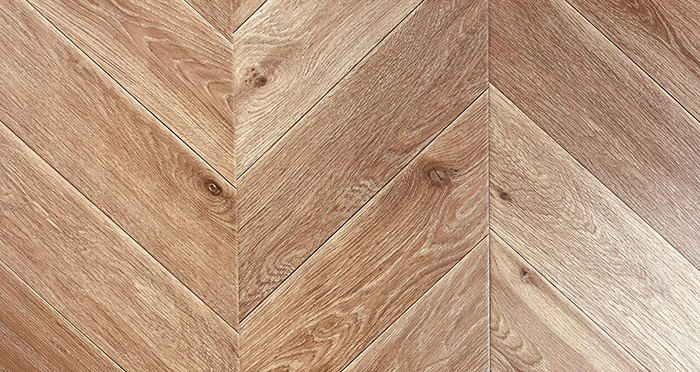 Portofino Chevron - Spiced Rum Oak Laminate Flooring - Descriptive 1