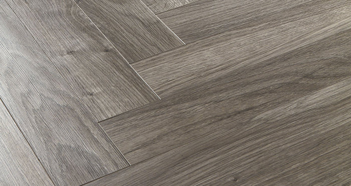 Vintage Chateau Herringbone - Light Grey Laminate Flooring - Descriptive 2